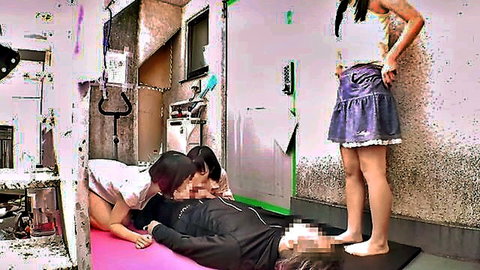 Three slim Asian women in intimate group play with lying man, censored