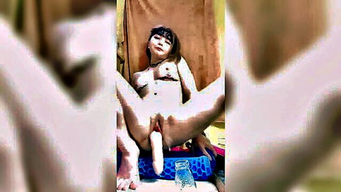 Petite Asian woman spreads legs, inserts blue dildo in wet pussy solo