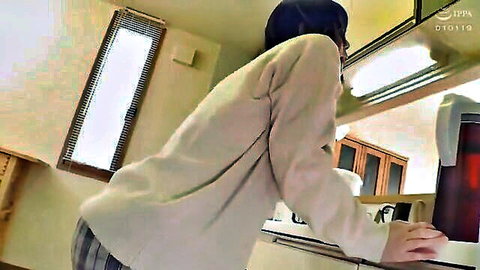Asian woman in plaid skirt bending over, teasing view from behind