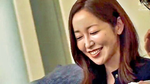 Cute Asian woman with plump lips smiling seductively in tight top teasing for cock suck