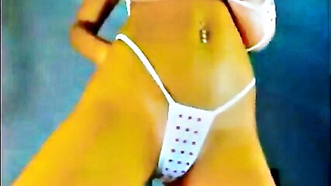 Stunning busty babe teasing in revealing white polka dot thong