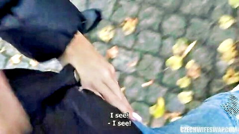 Czech wife in black coat gesturing excitedly outdoors in fall, from Wife Swap series