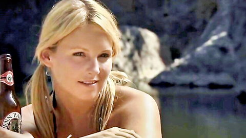 Mercy Malick topless nude scene from Maneater (2009) holding beer outdoors