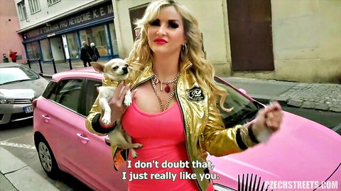Blonde Czech model Jaruska posing with Chihuahua by pink car in sexy pink top