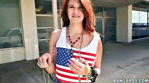 Redhead hottie in American flag tank top smiling outdoors on Bang Bus