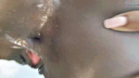 Black Karter's intense facial cumshot close-up from creampie sex video