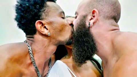 Two muscular shirtless black men passionately kissing sexy woman in white top threesome