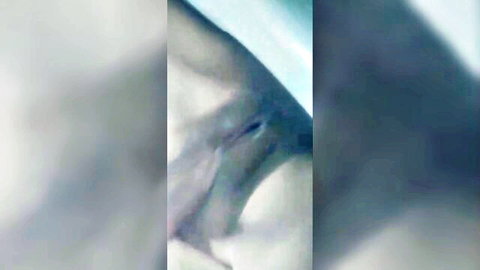 Blurry close-up of MILF masturbating solo in bathroom, explicit pussy view