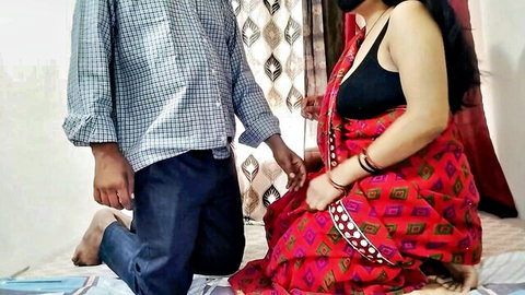 Priya in red saree sits intimately with partner, teasing bedroom moment