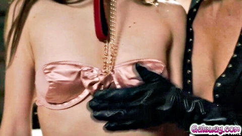 Lena Spanks as Helena in pink lingerie with BDSM leash and gloved hand