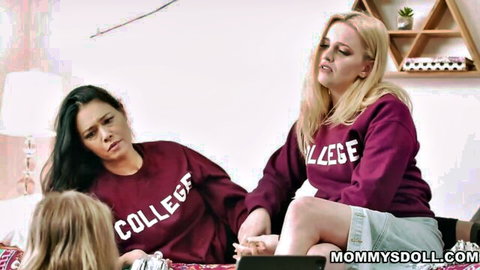 Two stepmoms in college sweatshirts seduce virgin blonde stepdaughter on bed