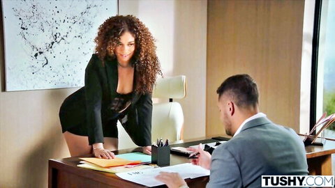Curvy Willow Ryder in sexy black blazer and short skirt bending over desk in Tushy office scene