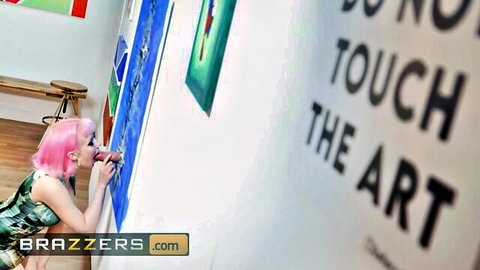 Pink-haired babe bends over in tight green shorts painting art with juicy ass up for Brazzers.
