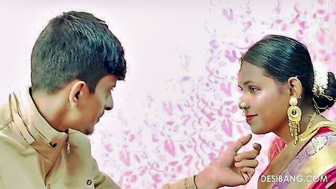 Indian wife in red saree teases husband's lips with finger in intimate taboo moment