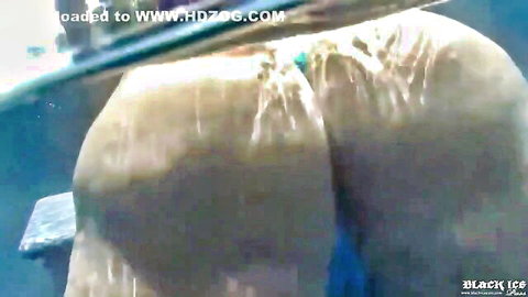 Wet ebony big ass cheeks glistening with water and blue thong in closeup