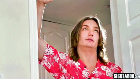 Long-haired guy in red Hawaiian shirt smirking while leaning on door frame seductively