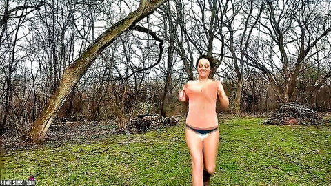 Topless amateur babe with big bouncy natural tits jogging in pink panties through foggy woods