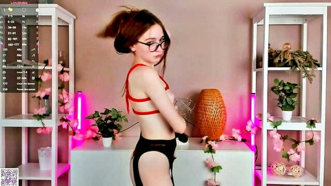 Reagan Prigg skinny redhead in red harness lingerie posing sideways