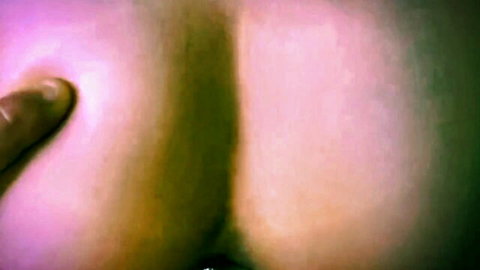 Close-up of curvy woman's big ass with hand grabbing between cheeks