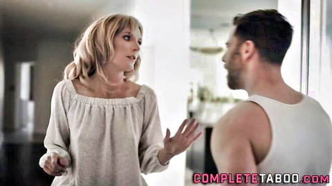 Blonde cougar in off-shoulder top confronts muscular shirtless man
