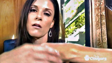 India Summer gorgeous cougar seductively extending hand in close-up