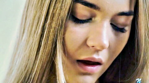 Hazel Grace seductive close-up, blonde hair and inviting pink lips