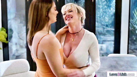 Blonde stepmom with big tits embraces busty brunette stepdaughter intimately