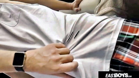 Gay twink lies back while buddy's hand gropes his crotch through plaid shorts