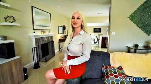 Busty blonde Skylar Vox in white blouse and red skirt, teasing on couch POV