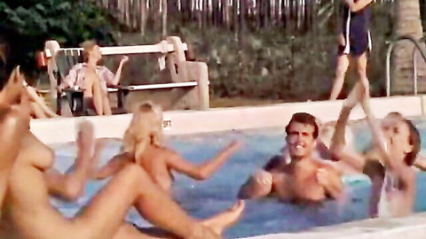 Vintage blonde nudists with big bare tits splashing naked in outdoor pool