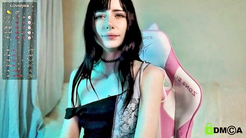 Skinny goth teen girl with small tits teasing in slipping black top on webcam