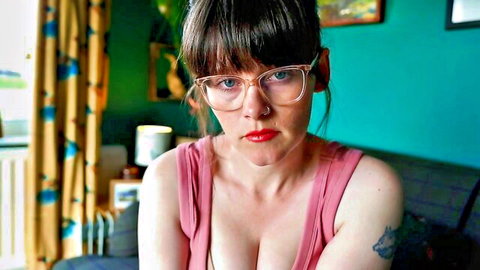 Sydney Harwin in low-cut pink tank top, glasses and cleavage for mommy fetish video