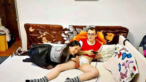 Petite teen in skirt and panties cuddles with Alex while gaming