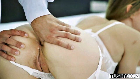 Blonde babe's shaved pussy and tight ass spread wide by man's hand in white lingerie