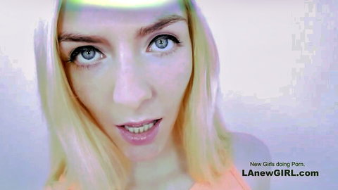 Blonde girl with surprised expression and glossy lips in adult video thumbnail