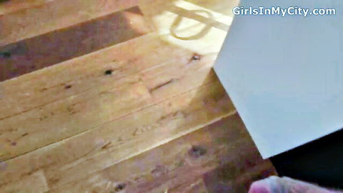 Sunlit wooden floor in empty adult video room from GirlsInMyCity.com