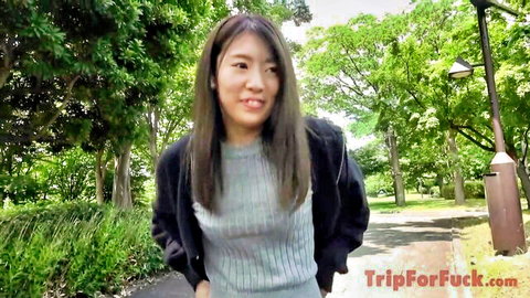 Smiling Asian woman in gray sweater outdoors, Japanese amateur tease