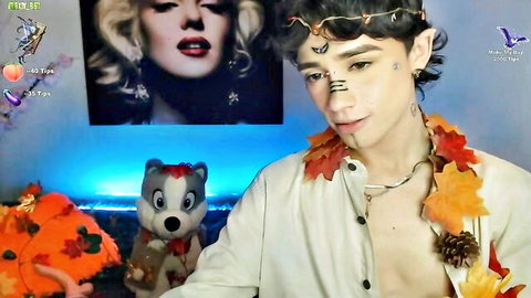Sexy elf-like guy in open shirt with autumn leaves, teasing gay solo pose