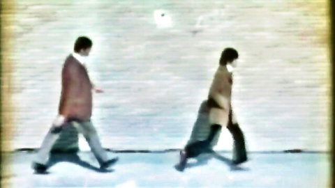 Vintage couple walking in coats from Lasse Braun porn film