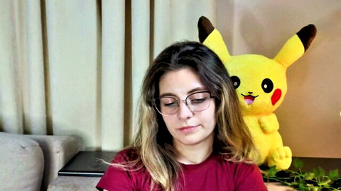 Lelahcaminero cute young cam girl with glasses and Pikachu plushie