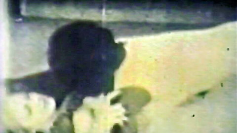 Vintage interracial group sex scene in classic American stag film