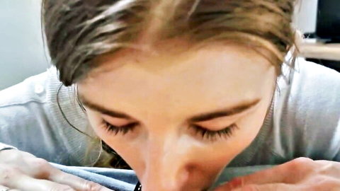 Beautiful blonde girlfriend eagerly swallowing cum in close-up blowjob
