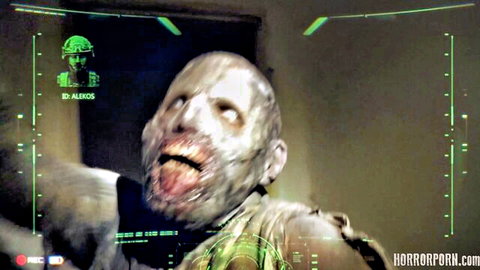 Terrifying snarling zombie face with tongue out in green HUD horror porn overlay