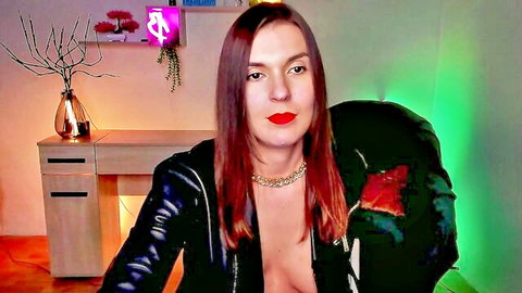 Redhead amateur in open leather jacket showing cleavage