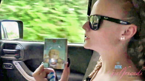 Paris White blonde in sunglasses holding card in car from ATK Girlfriends