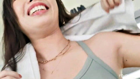 Jade Sky smiling in green tank top, teasing with towel, Asian beauty reveal