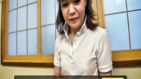 Cute Japanese woman in white polo shirt posing sensually by shoji window