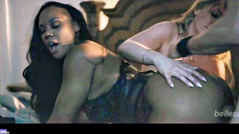 Ebony babe's big bare ass spread by blonde's hand in steamy threesome foreplay on bed