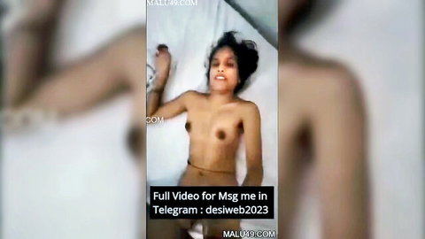 Indian slender wife topless smiling lying on bed