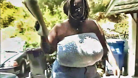 Curvy ebony woman with huge breasts in teasing outdoor pose from gangbang scene